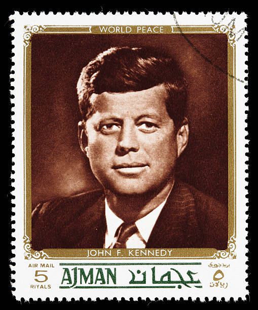 World peace John F. Kennedy postage stamp Sacramento, California, USA - December 24, 2008: A 1972 Ajman postage stamp in the "world peace" series with an image of John Fitzgerald Kennedy (1917-1963). JFK was the 35th president of the United States (1961-1963). postage stamp photos stock pictures, royalty-free photos & images