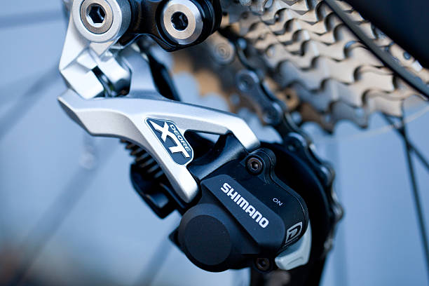 Schaumburg, USA - October 14, 2013: Close-up of Shimano XT Deore mountain bike rear derailleur with cassette and chain installed on Scott Spark 940 bike.