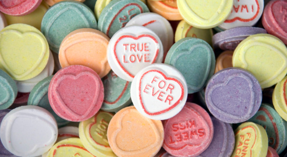 London, United Kingdom, August, 28 2007: Iconic retro sweets with heart shape pattern and messages:  True love, Forever.