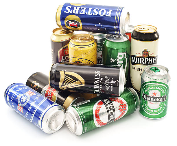 Cans of beer pile isolated on white Celje, Slovenia - March 19, 2011: Different cans of beer in a pile isolated on white background. Well known beers like Heineken, Fosters, Amstel, Carlsberg, Guinness, Beck's and others are in selection. guinness photos stock pictures, royalty-free photos & images