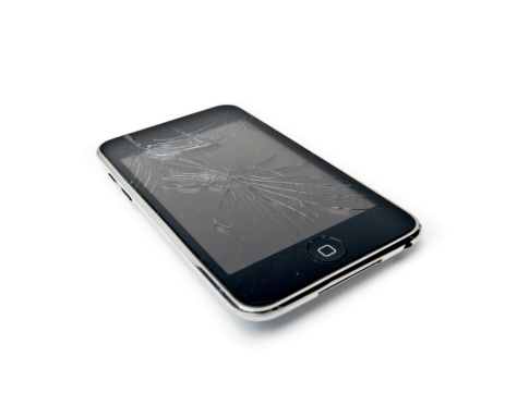 Alston, UK - September 23, 2010: An Apple IPod Touch with a cracked screen, isolated on white.