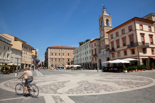 Rimini, Italy -  July 4, 2011:  View over the Tre Martiri square towards Corso Augusto in the historical town center on a busy summer morning.