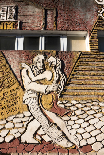 Buenos Aires, Argentina - June 27, 2009: Relief mural with a tango dancers couple. Walls in the street and facade in La Boca neighborhood.