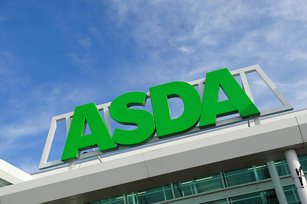 Asda Supermarket Birmingham, England - March 14, 2011: Asda sign on storefront. Asda is a British supermarket chain which retails food, clothing, toys and general merchandise. Asda became a subsidiary of the American retail giant Wal-Mart, the world\'s largest retailer in 1999. asda photos stock pictures, royalty-free photos & images