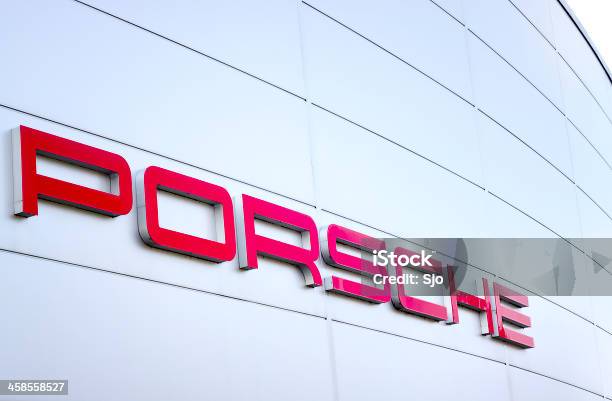 Porsche Sports Car Manufacturer Logo Outside A Dealership Stock Photo - Download Image Now