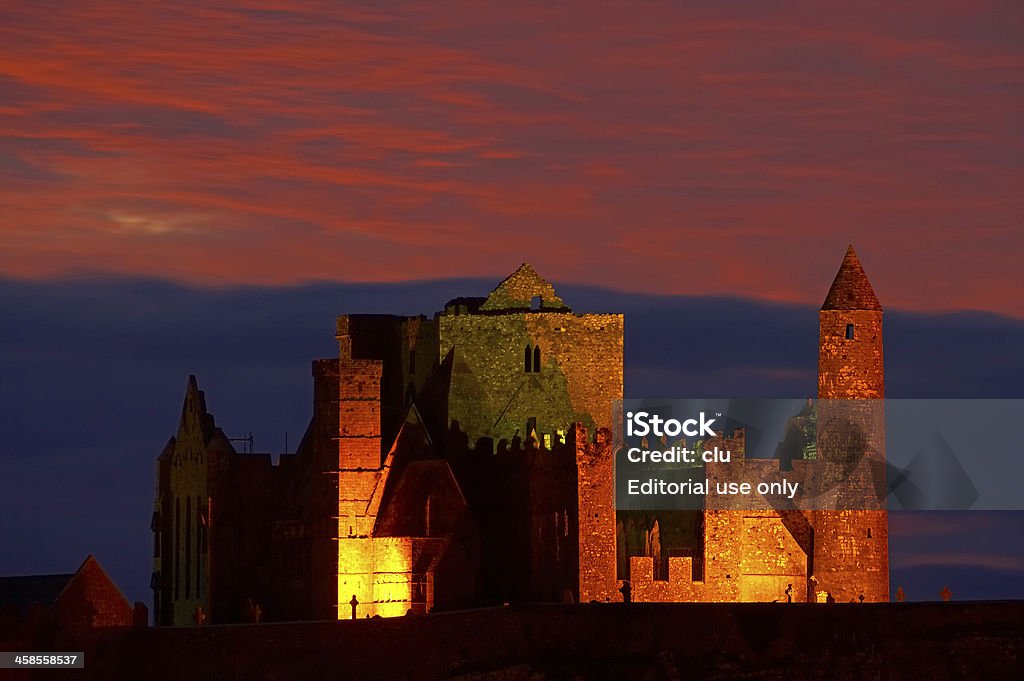 Rock of Cashel at sunset - Ireland Cashel, Ireland  - September 9, 2007: View of the Rock of Cashel at sunset. The rock of cashel is located at the city of cashel, 20 km north of Cahir in the the county Tipperary. Night Stock Photo