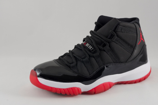 Bergen County New Jersey, USA - September 8, 2013: A Nike Air Jordan XI shown here in a black and varsity red colorway, was released as part of the 