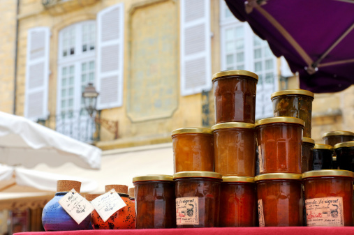 Sarlat, France - July 3, 2010: Typical french marmalade and honey on sale at a market on the Rue la LibertÃ© in Sarlat, Perigord, France.