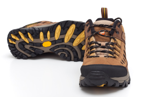 Trebnje, Slovenia, - November 06, 2011: Merrell hiking shoes.Merrell is a footwear company founded by Clark Matis, Randy Merrell, and John Schweitzer in 1981 as a maker of high-performance hiking boots. Since 1997 the company has been a wholly owned subsidiary of shoe industry giant Wolverine World Wide. The company recorded total sales of footwear and clothing totaling nearly $500 million in 2010. Vibram S.p.A. is an Italian company based in Albizzate that both manufactures and licenses the production of Vibram-branded rubber outsoles for footwear