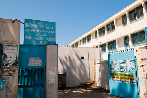 Tyre, Lebanon - September 1, 2010: Entrance to a school operated by the United Nations Relief and Works Agency for Palestine Refugees in the Near East (UNRWA) in the Al-Bass Palestinian refugee camp in the city of Tyre. UNRWA provides assistance, protection and advocacy for some 4.8 million registered Palestine refugees in Jordan, Lebanon, Syria and the Palestinian Territories