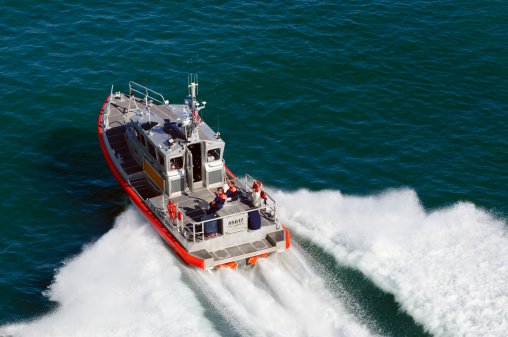 Port Canaveral, FL, USA - March 19, 2011: A U.S. Coast Guard response boat-medium (RB-M) vessel on the Florida coast. Forty-five feet (13.7 m) in length with a top speed of 42 knots (78 km/h), it has the capacity to tow a 100-ton vessel in eight-foot seas.
