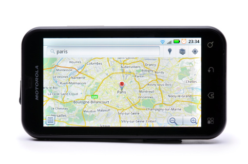 Tokmak, Ukraine - April 3rd, 2011: Motorola Defy smart phone isolated on white background showing Google Maps. Google Maps is a online web service application provided by Google for navigation assistance