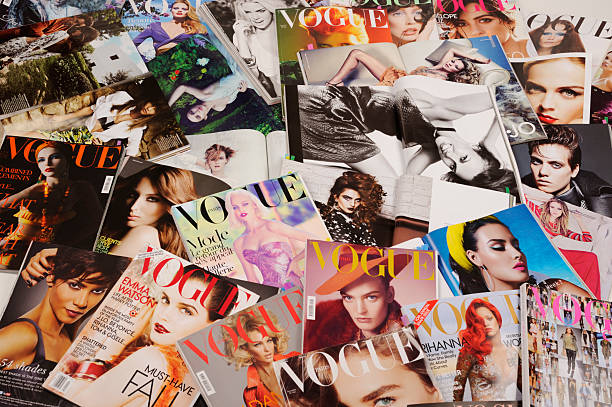 Fashion magazines Seoul, Korea - January 8, 2012:Studio product shot of covers, fashion spreads and the advertising images of fashion  magazines, VOGUE. Fashion spreads and teas sheets are for research and making up a fashion story. vogue cover stock pictures, royalty-free photos & images