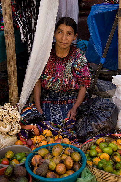 Woman selling fruit at Chichicastenango market, Guatemala stock photo