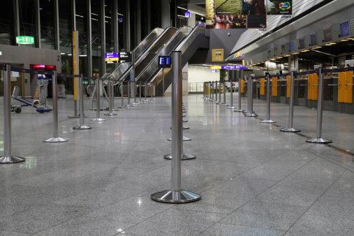Frankfurt, Germany - March 19, 2011: Wide angle shot of Terminal 1 at Frankfurt airport. This is the guiding barrier which forms hundreds of flight passengers into a queue at daytime.