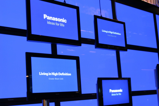 Berlin, Germany - August 30, 2007: Wall with flat screen TVs from Panasonic. Panasonic is a Japanese multinational consumer electronics corporation. It\'s brand slogan is \