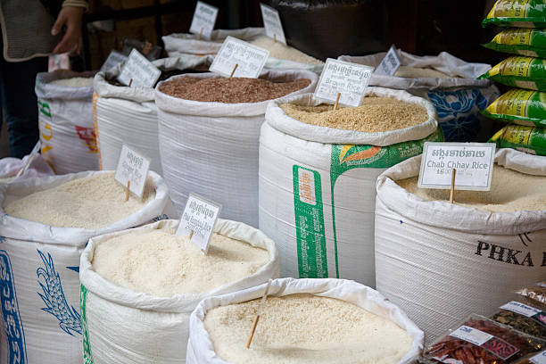 Siem Rep, Cambodia - April 17, 2011: different kinds of rice in big bags close-up in local market in Siem Reap