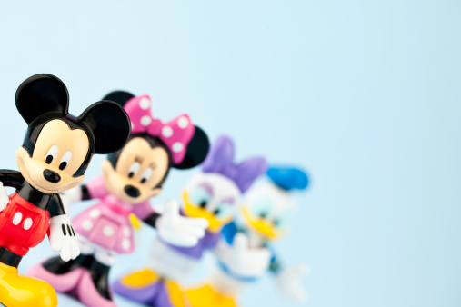 Suffolk, Virginia, USA - April 30, 2011: A horizontal studio shot of the Disney cartoon characters Mickey Mouse, Minnie Mouse, Daisy Duck and Donald Duck. Here Mickey Mouse is standing in the foreground and is the focal point of the image, while the other characters are defocused in the background.
