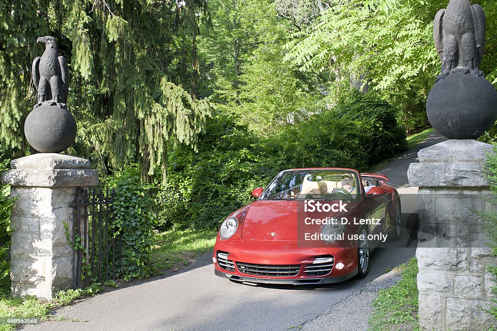 Porsche 911 Turbo Nashville, Tennessee, USA - June 12th, 2010: A maroon 997 generation Porsche 911 Turbo convertible being driven down a driveway. Porsche 911 Stock Photo