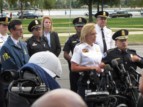 Washington DC, USA-October 3, 2013:  A press conference is held at the shooting location near the US Capitol in Washington DC. Washington DC Police Chief Cathy Lanier is the blond woman in the white uniform flanked by other public officials.  A 34 year old woman rammed a security barricade at the White House and then fled.  Police gave chase and fired at her car where it came to a halt near the US Capitol building.  A 1 year old child was rescued from the car, however the woman driver died.  Two officers were hurt-a secret service officer who was struck at the White House and a Capitol Police Officer whose car struck a barricade near the US Capitol building.  The media is awaiting a press conference by Washington DC Police chief Cathy Lanier and other top officials.