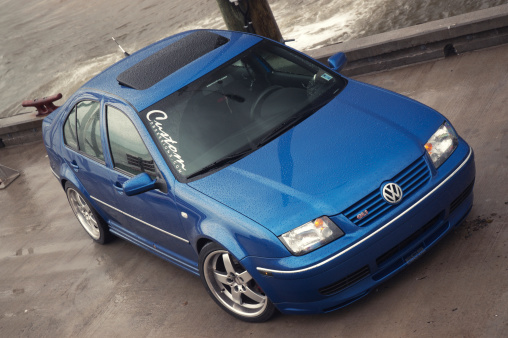 Halls Harbour, Canada - October 16, 2005: A customized Volkswagen Jetta GLI sedan parked on the pier.  Car is lowered with aftermarket wheels.