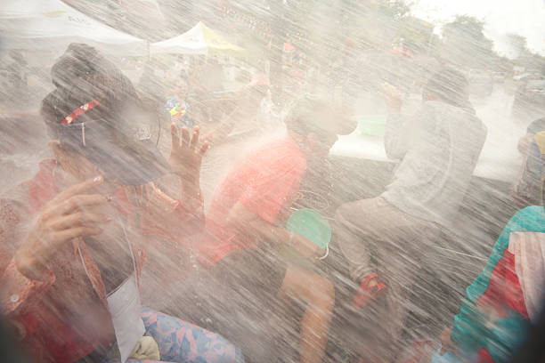 Ayuttaya, Thailand - April 15,2013: Unidentified Thai peoples and elephant mahout forced to dancing and splashing water in Songkran Festival ( Water Festival ) is celebrated in a traditional New Year's Day from 13 to 15 April 2013, in Ayuttaya Province,Thailand.