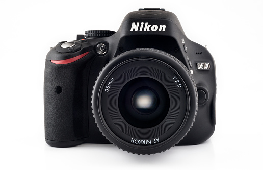 Chiang Mai, Thailand - May 3, 2011: Nikon D5100 DSLR camera with a 35mm auto focus lens. This camera model was released in April 2011 and is made in Thailand.