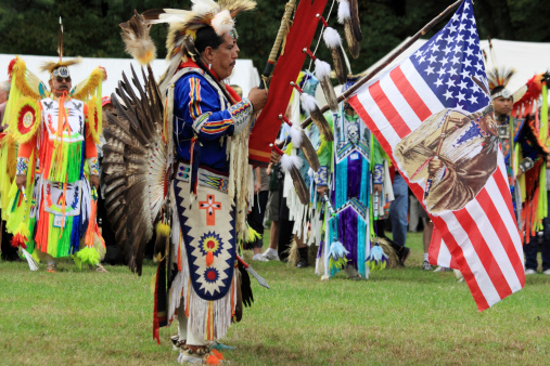 Yorktown Heights, USA - September 24, 2011: The individuals are some of many Native American who are participating at a Pow Wow. A Pow Wow is an American Native social gathering or fair which usually includes competitive dancing or discussions. Present at this gathering are members of the Aztec, Lakota, Oneida, Shinnecock, and the Narragansett among others.