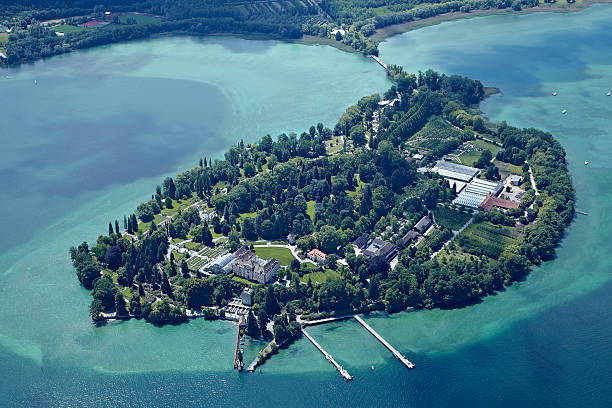 Isle of Mainau, Germany - June 5, 2012: Isle of mainau aerial view showing the castle, the gardens and all agricultural buildings. The isle is located on the lake constanze in South Germany, close to the city of Constanze. It is one of the most visited tourist destinations in Germany showing formal gardens and flowers at its best.
