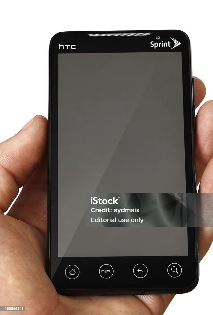 HTC Evo w rękę na białym tle - Zbiór zdjęć royalty-free (Białe tło)