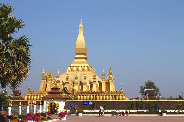 Pha That Luang temple in Vientiane Vientiane, Laos - February 02, 2011: Pha That Luang temple is today in modern Laos the National Symbol of the communist country and has a long history dating back to the 3rd century. pha that luang buddhist stupa in vientiane laos stock pictures, royalty-free photos & images