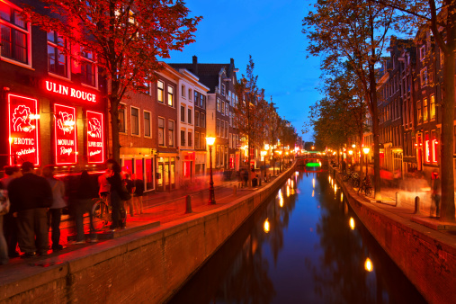 Amsterdam, The Netherlands - May 09, 2011: Red Light District in Amsterdam. Night View Of Amsterdam Canals.