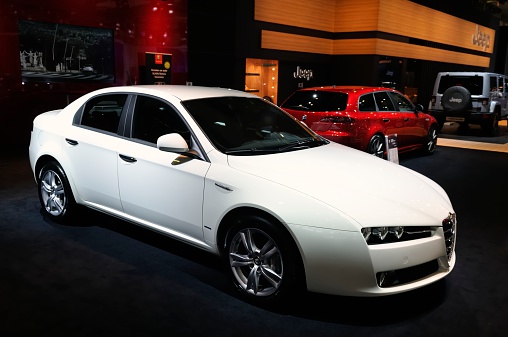 Side, Turkey – February 05 2023: white Alfa Romeo  147  is parked  on the street on a warm day