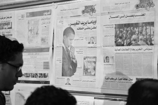 Cairo, Egypt - February 9, 2011: During the 2011 anti-government demonstrations in Tahrir Square in Cairo, newspapers were daily posted on a wall so that protestors could keep abreast of developments.