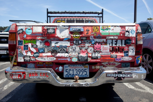 Daly City, California, USA - June 10, 2010: Rear of red pickup truck with likes, dislikes, and opinions of the owner.