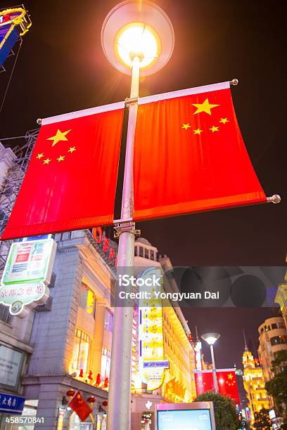 Chinese Flags And Colorful Neon Signs On Nanjing Road Stock Photo - Download Image Now