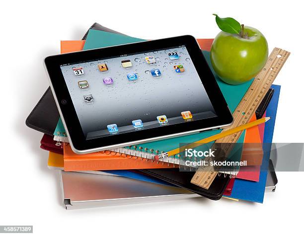 Apple Ipad On A Stack Of Books — стоковые фотографии и другие картинки Белый фон - Белый фон, Учебник, iPad