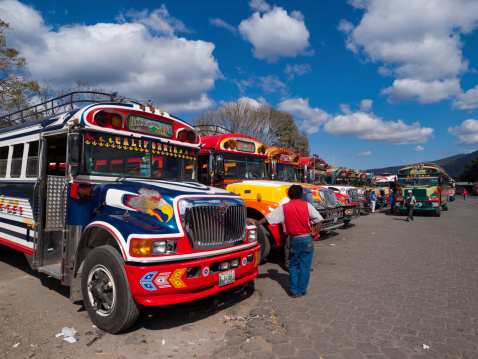 Antigua, Guatemala - January 13, 2009: Row of brightly coloured busses, affectionally known as \