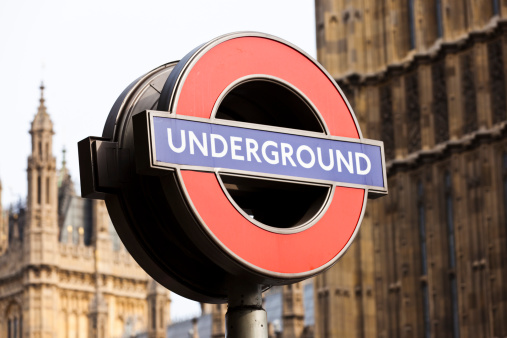 London, UK - May 5, 2010: A London Underground famous sign in London near Big Ben, Westminster. Underground is called The Tube or The Underground and it is the oldest underground railway in the world.