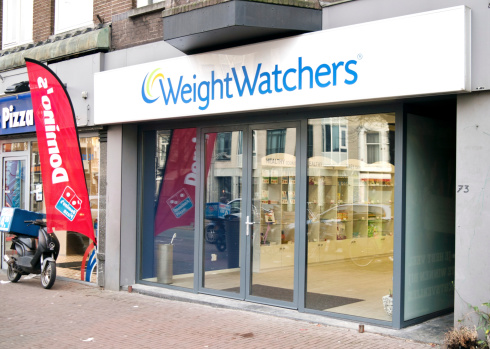 Amsterdam, The Netherlands - January 28, 2012: Weight Watchers store in Amsterdam. The store is open during regular retail hours, so that people can stop in anytime to learn more about Weight Watchers, ask questions, purchase memberships or shop for Weight Watchers products.