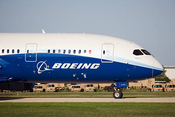 Boeing 787 Dreamliner Wittman Regional Airport, Oshkosh, Wisconsin, USA - July 29, 2011: Boeing 787 taxing to runway for takeoff at the Air-Venture airshow. airshow photos stock pictures, royalty-free photos & images