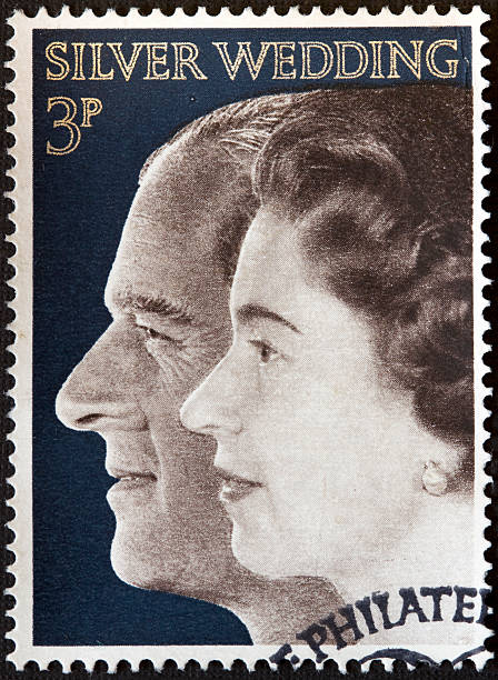 Silver Wedding Stamp Denny, Scotland - January 13, 2010: A 1972 stamp depicting Queen Elizabeth II and Prince Philip.  Stamp first released 20th November 1972 prince phillip stock pictures, royalty-free photos & images