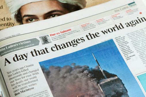 Denny, Scotland - May 3, 2011: Newspaper reports on the day Osama bin Laden died.  Pictures depict the Twin Towers atrocities of New York and Osama bin Laden.