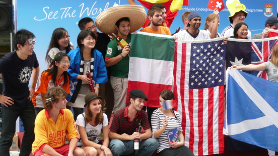 Hong Kong, China aa November 9, 2009: International students from different countries studying at the University of Hong Kong gather together at the University of Hong Kong. These students come from different parts of continents. Some of them hold their national flags. The event is organized by the University of Hong Kong. It represents internationalization in higher education