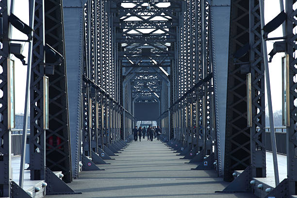 View of the Wuhan Yangtze Great Bridge, a historic double-deck road and rail bridge across the Yangtze River. The bridge extends 1.6 kilometers from Turtle Hill in Hanyang, on the northern bank of the Yangtze, to Snake Hill in Wuchang, on the southern bank of the Yangtze.