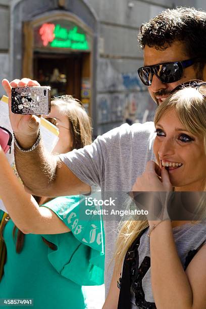 Boy And Girl Taking Photos With Cellphone Stock Photo - Download Image Now - 20-24 Years, Adult, Boys