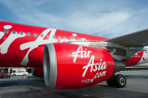 Kuala Lumpur, Malaysia - July 7, 2013: Air Asia Jet at Kuala Lumpur Airport preparing for departure to Singapore.