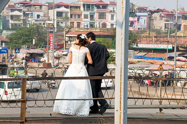 Hanoi, Vietnam - December, 4 2008: Newlyweds in Hanoi's old quarter. It's common in Hanoi for Newlyweds to go to the scenic old quarter of town to have their wedding pictures taken.