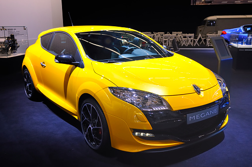 Amsterdam, The Netherlands - April 12, 2011: Yellow Renault Megane RS on display at the 2011 Amsterdam Motor Show. The 2011 Amsterdam motor show was running from April 12 until April 23, in the RAI event center in Amsterdam, The Netherlands.