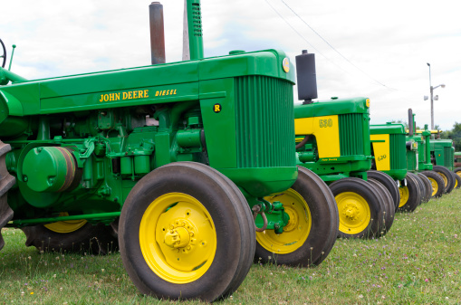 Drayton, Ontario, Canada - July 22, 2011: Vintage John Deere Tractors at the annual Upper Canada Two Cylinder Club show in Drayton Ontario. Focused primarily on vintage John Deere equipment 35 years and older.